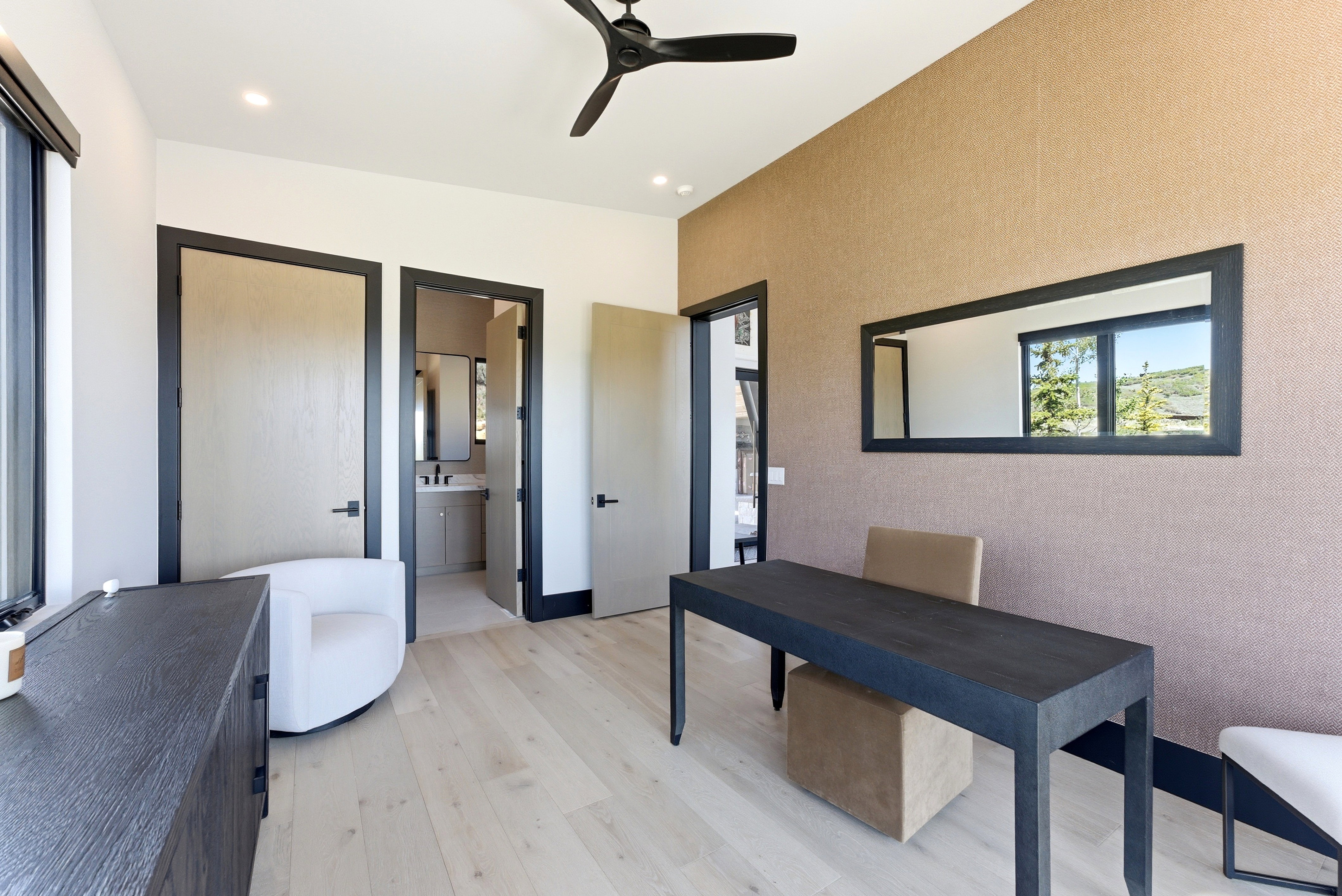 Interior space featuring light wood-finish flooring, a contemporary ceiling fan, and recessed lighting