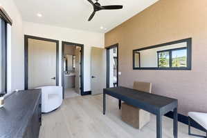 Interior space featuring light wood-finish flooring, a contemporary ceiling fan, and recessed lighting