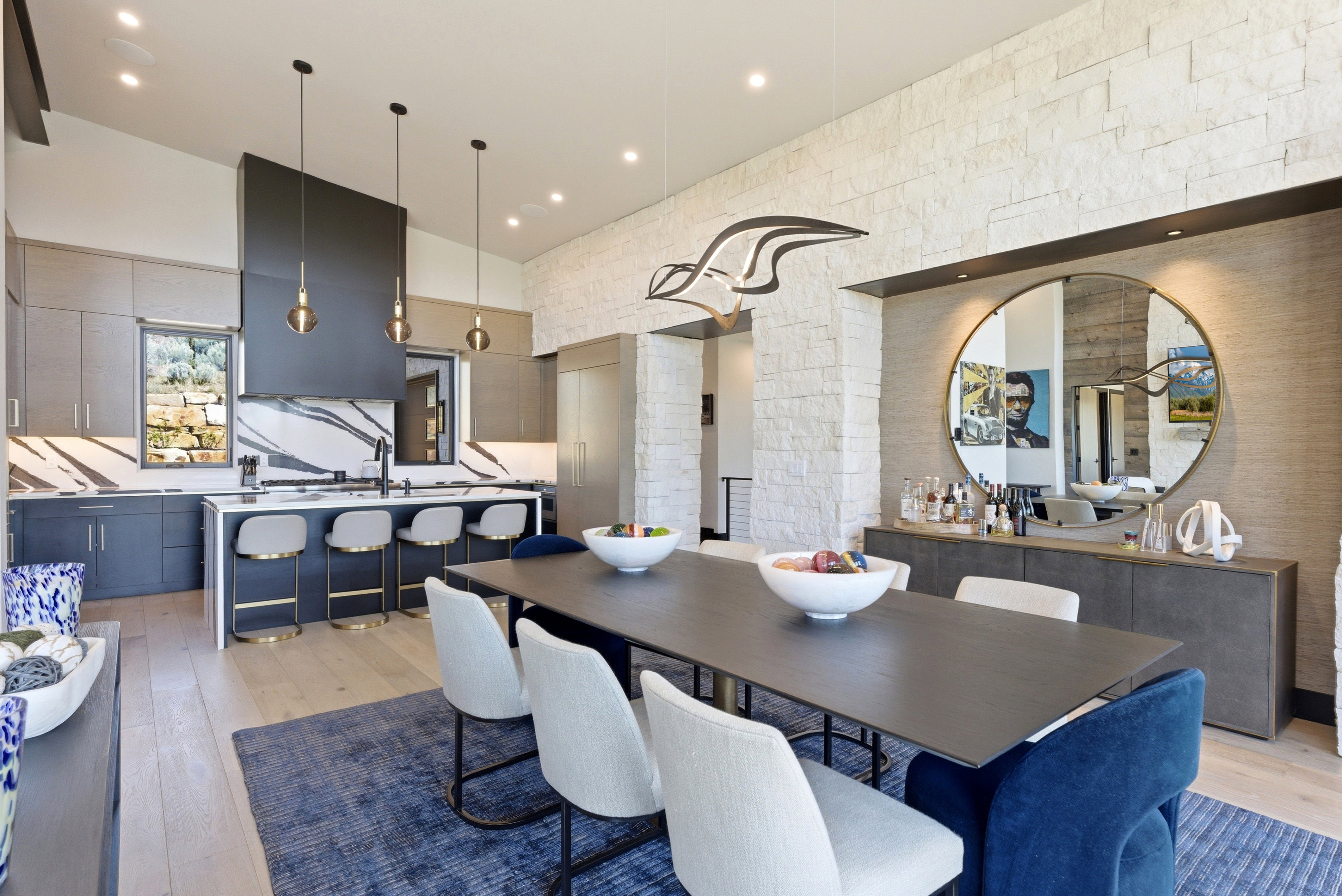 Open-concept kitchen and dining area featuring light wood-finish flooring