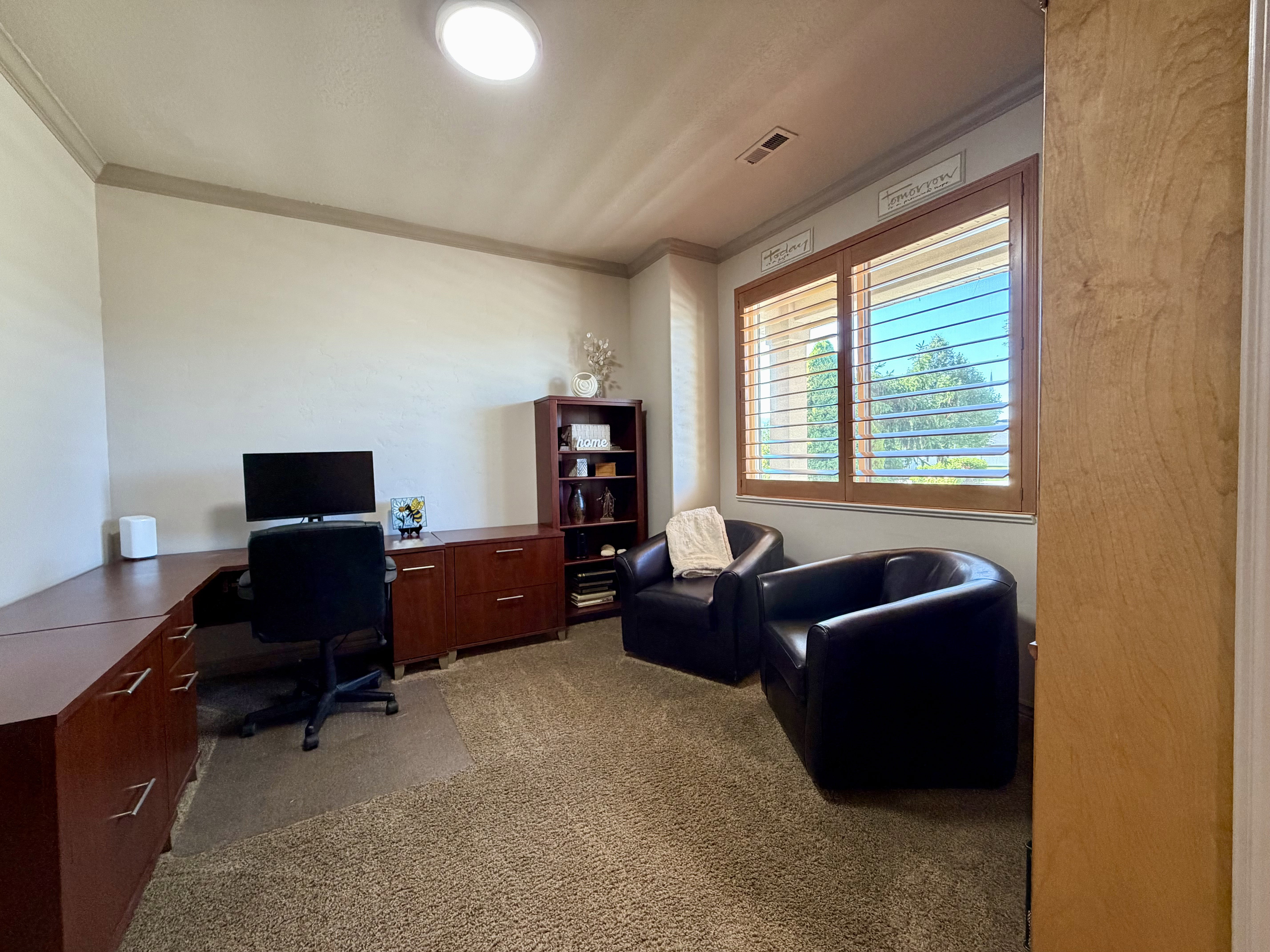 This roomy flex room could be used as an office or as another bedroom