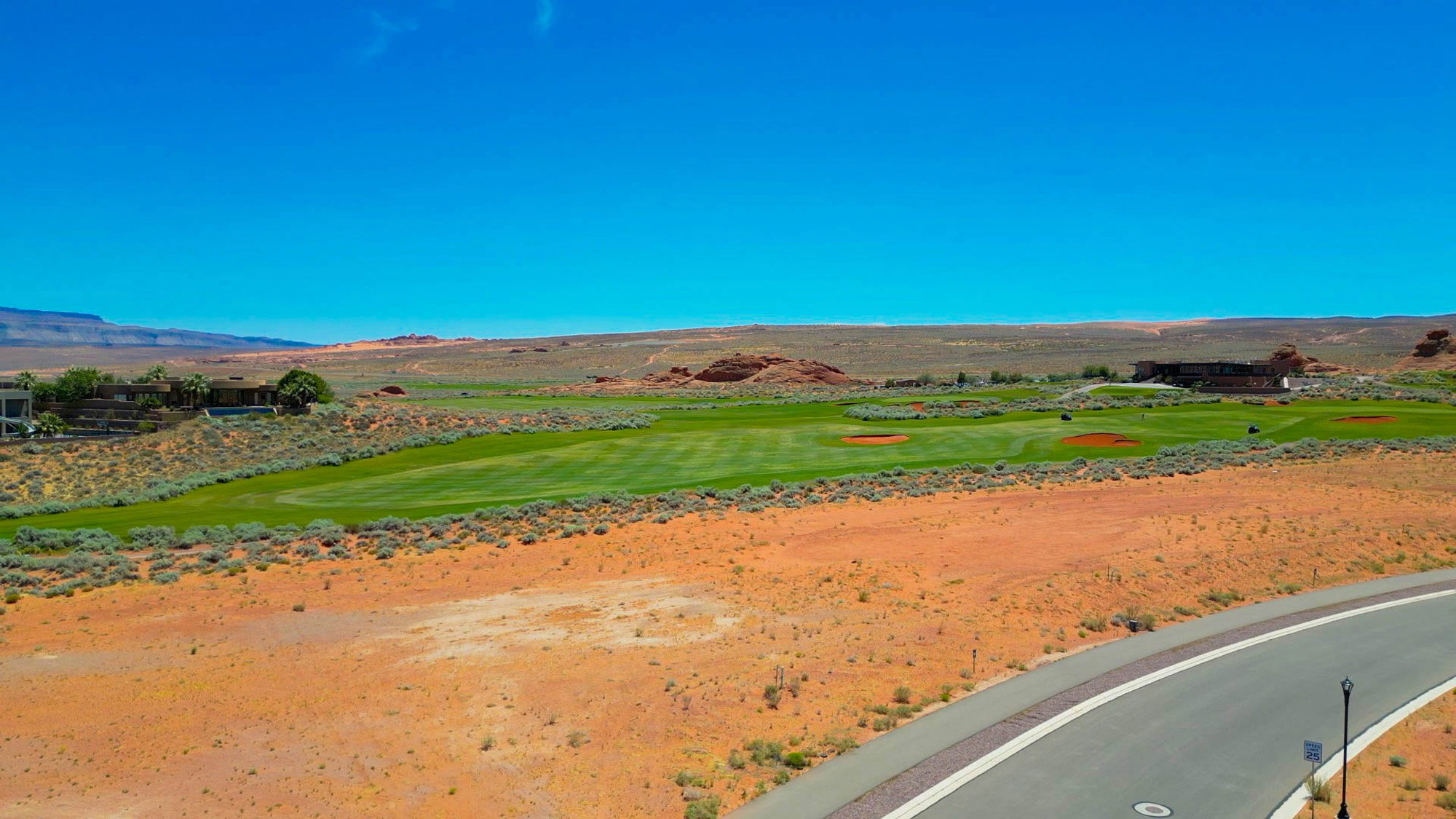 Expansive golf course property with manicured greens and natural desert landscaping