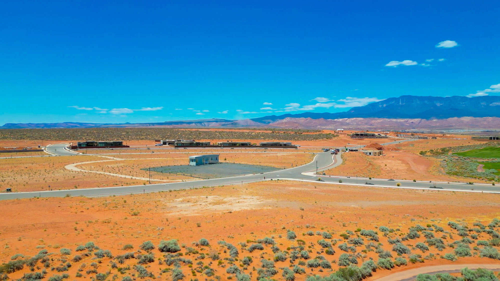 Expansive desert landscape with scattered low-lying vegetation