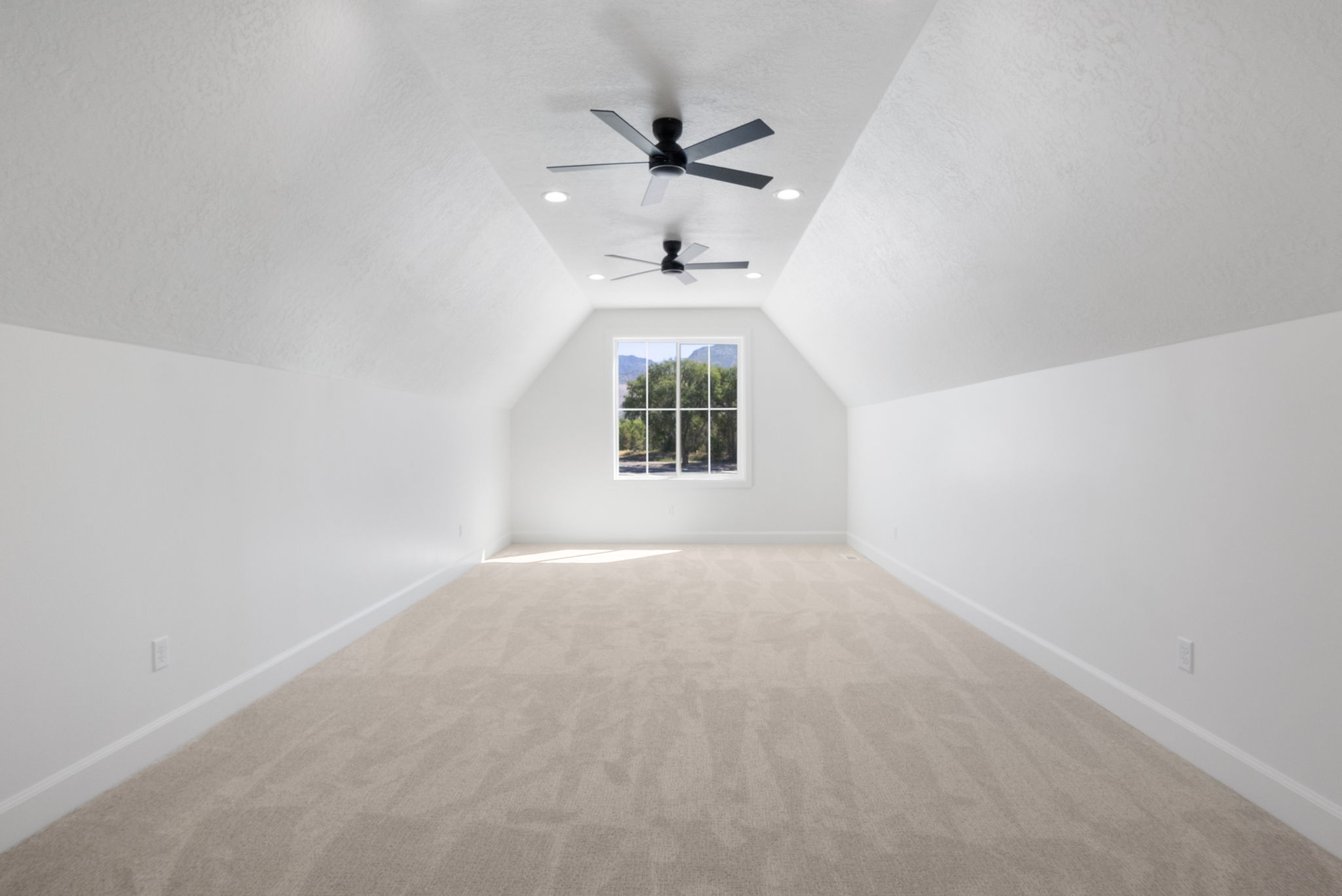 Carpeted bonus room featuring a window dormer, twin ceiling fans, recessed lighting, and white baseboards