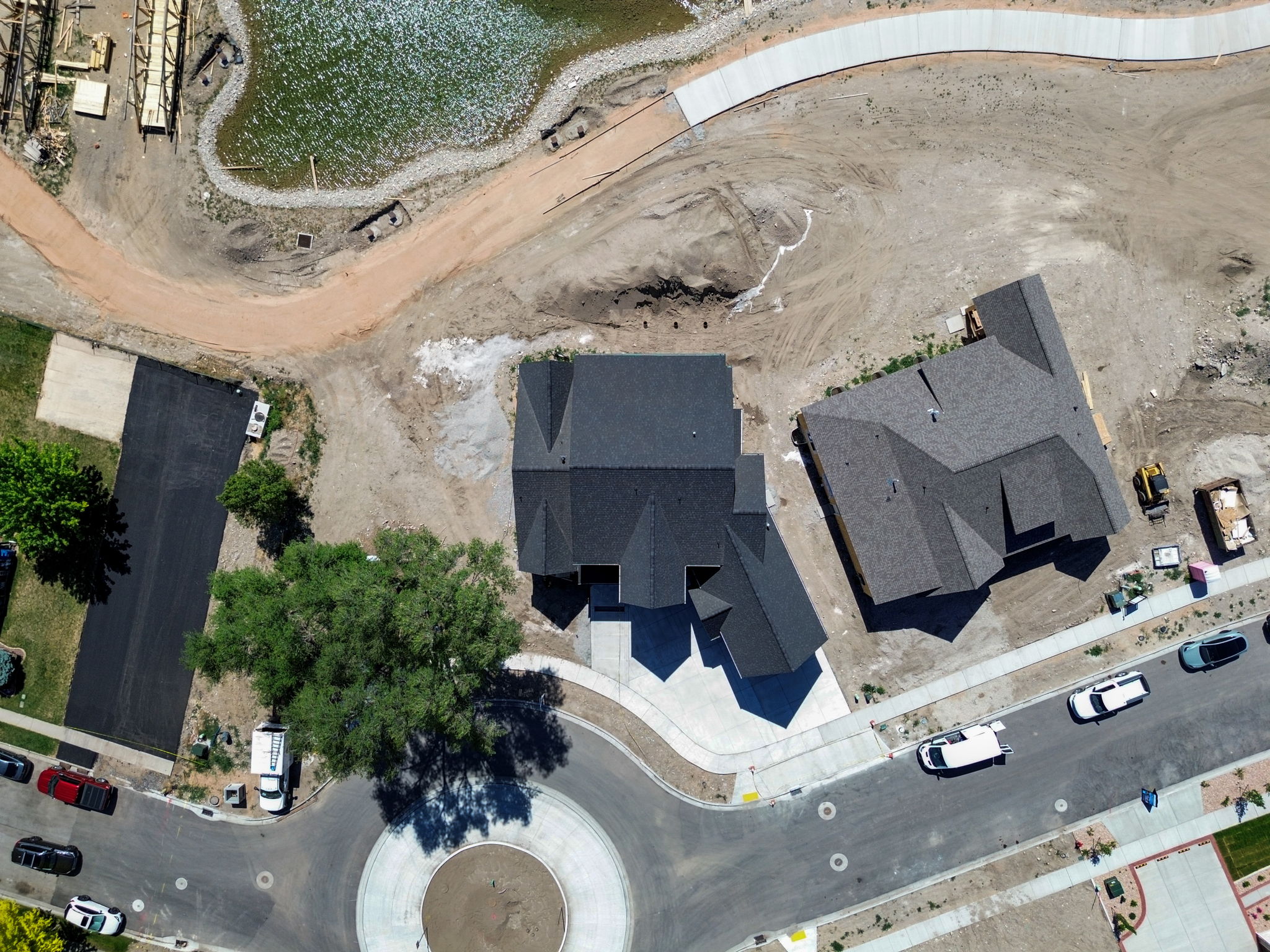 Newly constructed residence featuring a multi-gabled roofline and an attached two-car garage