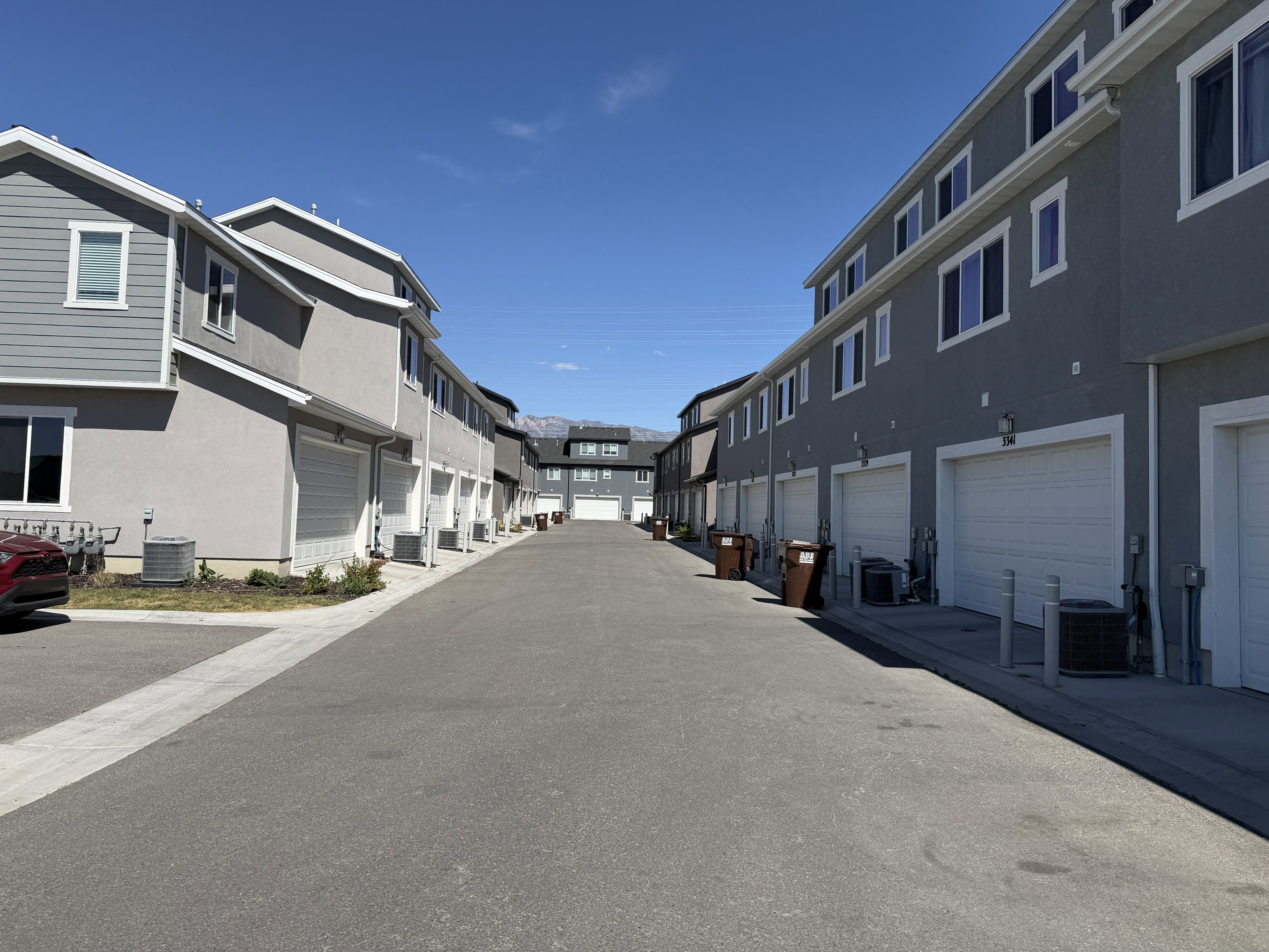 Modern townhome community featuring multi-level units with attached garages