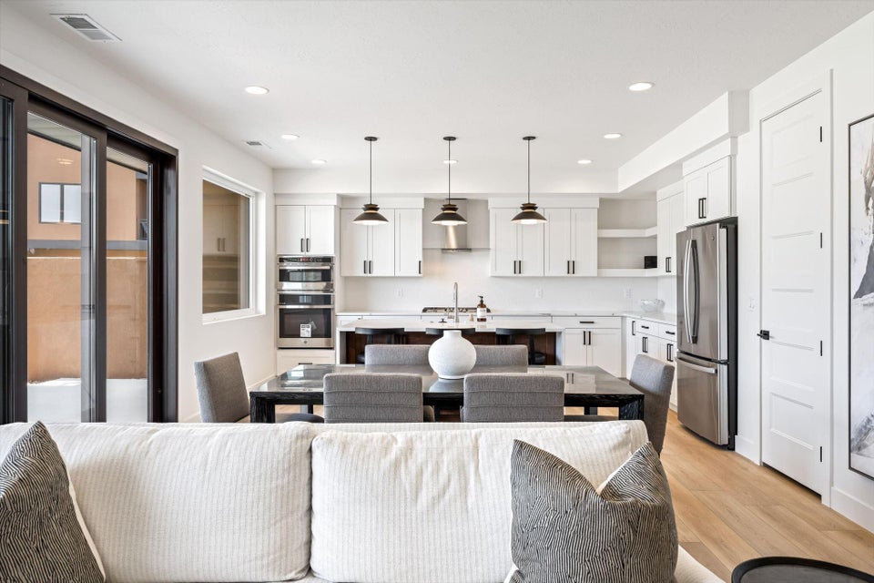 Open-concept living space with light wood-finish flooring
