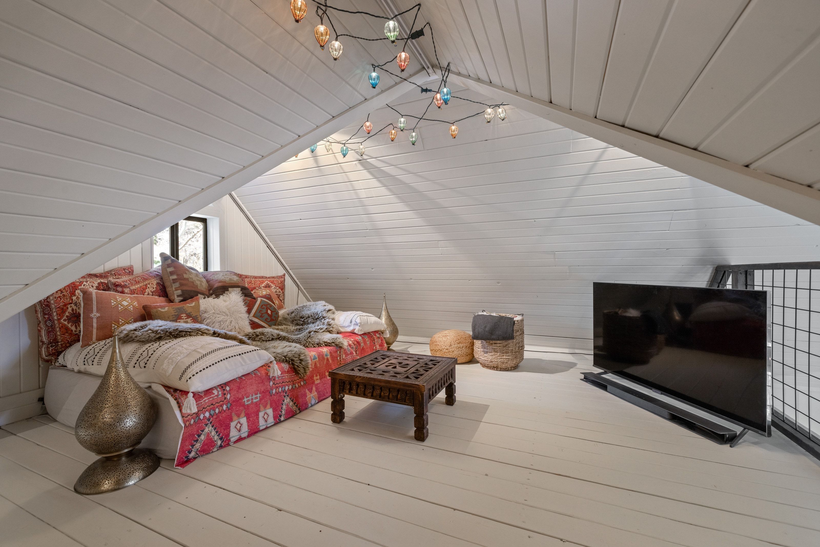 Bedroom with wood walls, wood-type flooring, and wood ceiling
