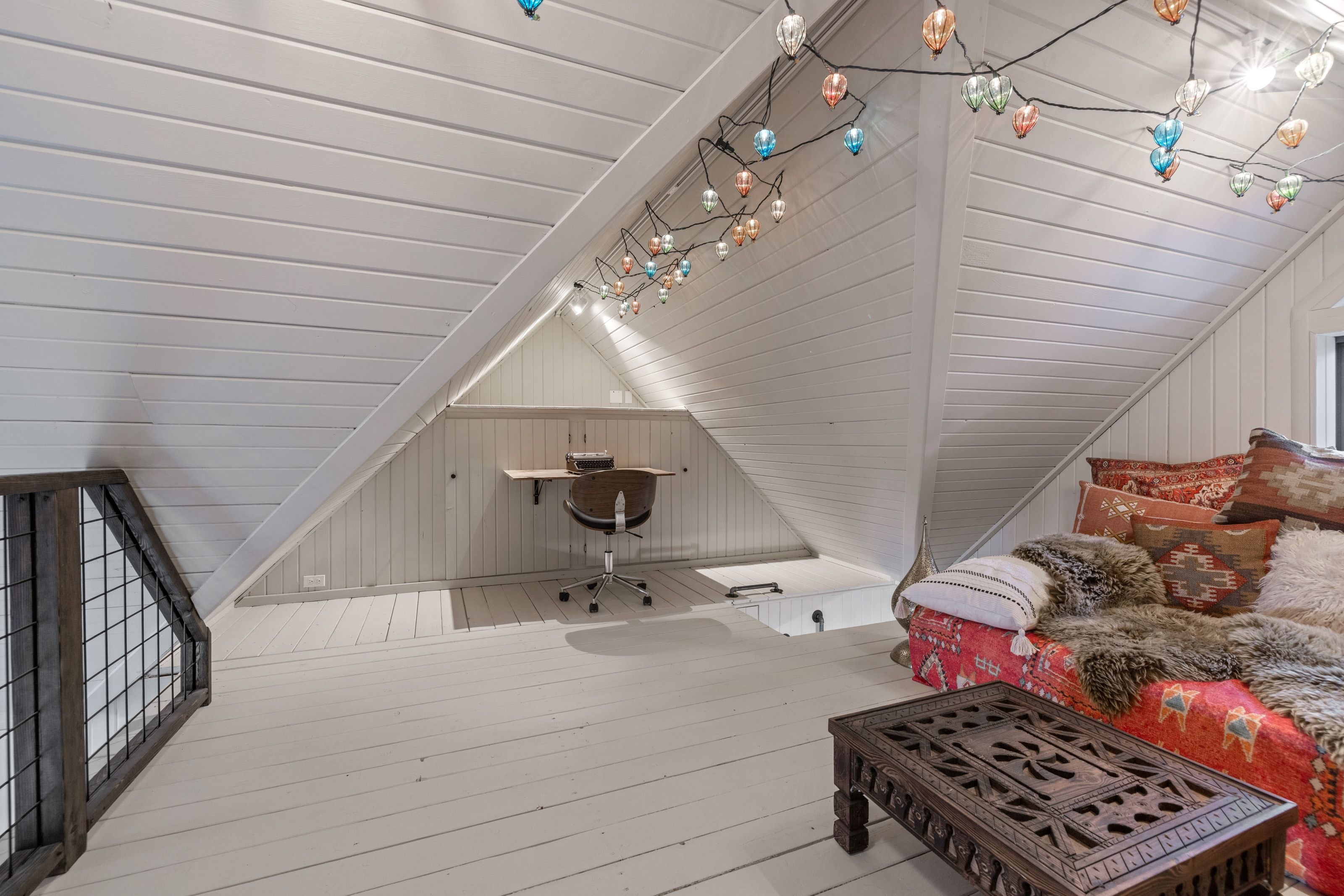 Additional living space featuring hardwood / wood-style flooring, vaulted ceiling, and wood walls