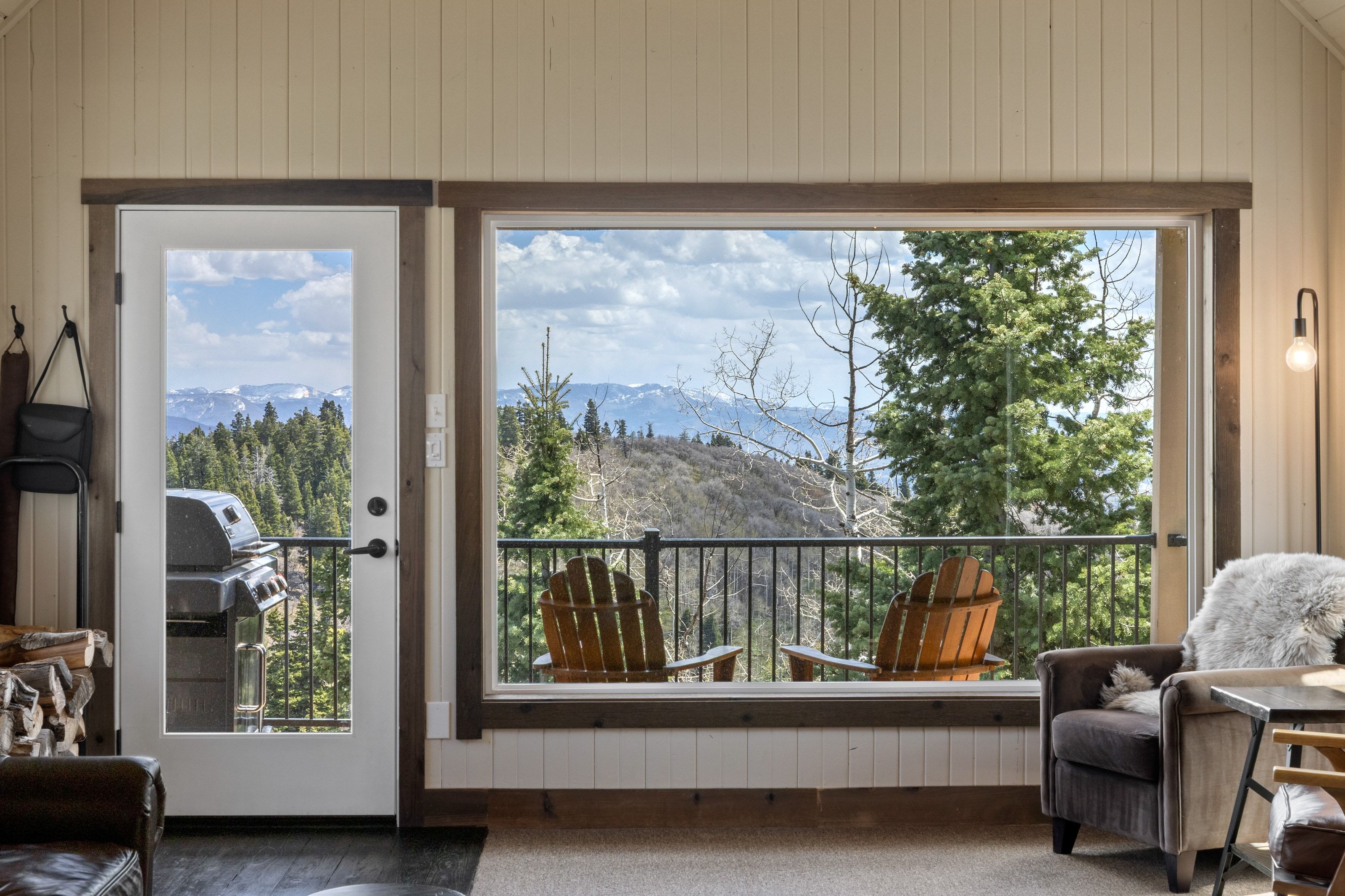 Doorway with a mountain view and wooden walls