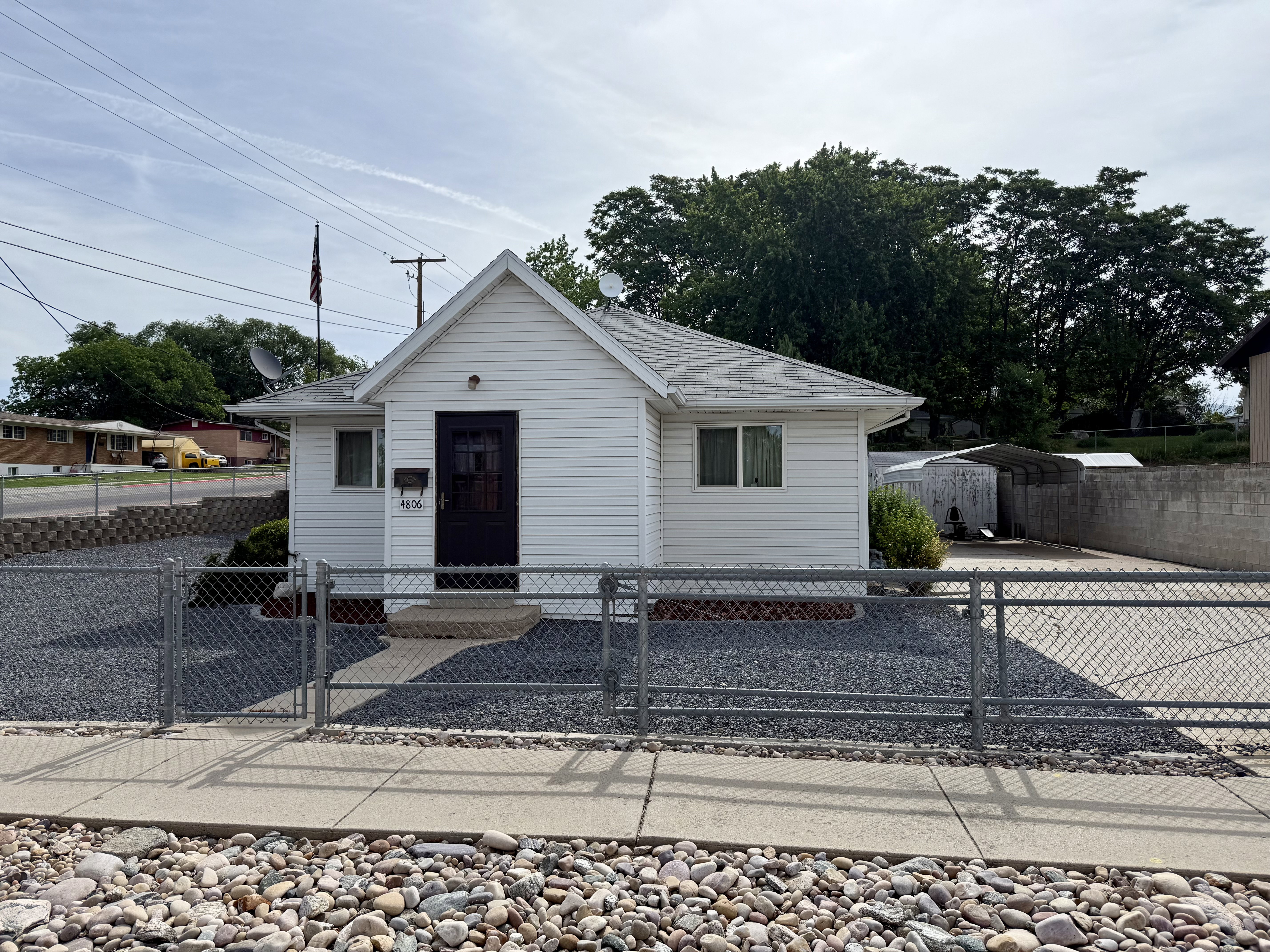White single-story residence with a gabled roof