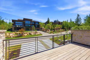 Spacious wood-finish deck with contemporary horizontal bar railing