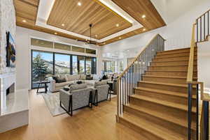 Hardwood staircase with black metal balusters and wood handrails