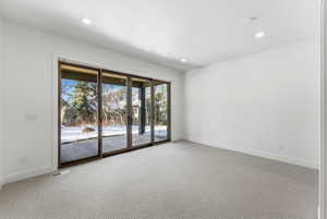 Bright interior space featuring a multi-panel sliding glass door system