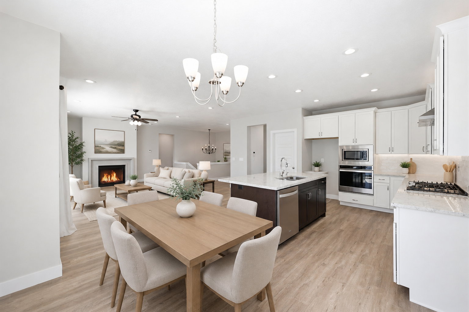 Open-concept living space featuring a dining area, kitchen, and living room