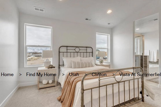 Light-filled room featuring two windows, carpeted flooring, and recessed lighting. These pictures are of another home.