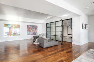 Expansive interior space featuring wide plank wood-finish flooring