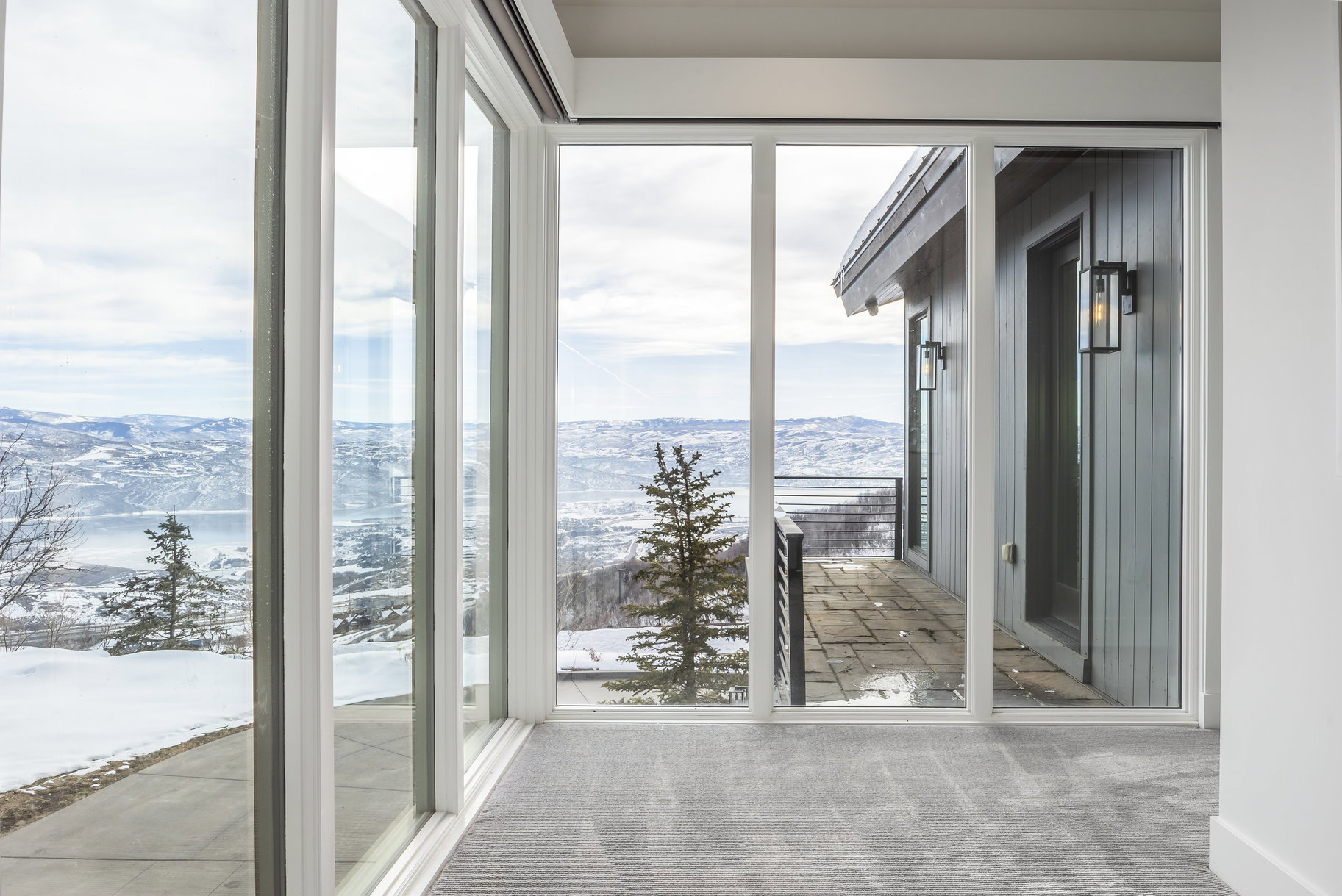 Floor-to-ceiling windows with expansive winter scenery