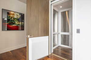 Residential elevator with a stainless steel interior and recessed lighting