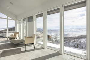 Floor-to-ceiling windows with expansive mountain scenery