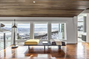 Panoramic window array showcasing a distant mountain and valley landscape