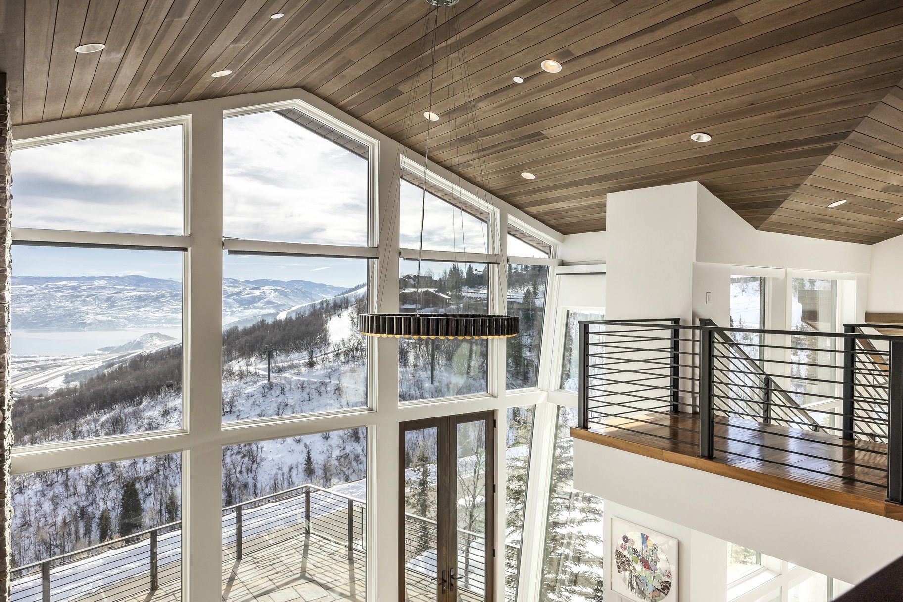 Vaulted ceilings with wood paneling and recessed lighting
