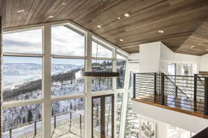Vaulted ceilings with wood paneling and recessed lighting