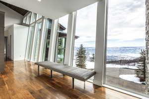 Expansive floor-to-ceiling windows featuring mountain and valley scenery