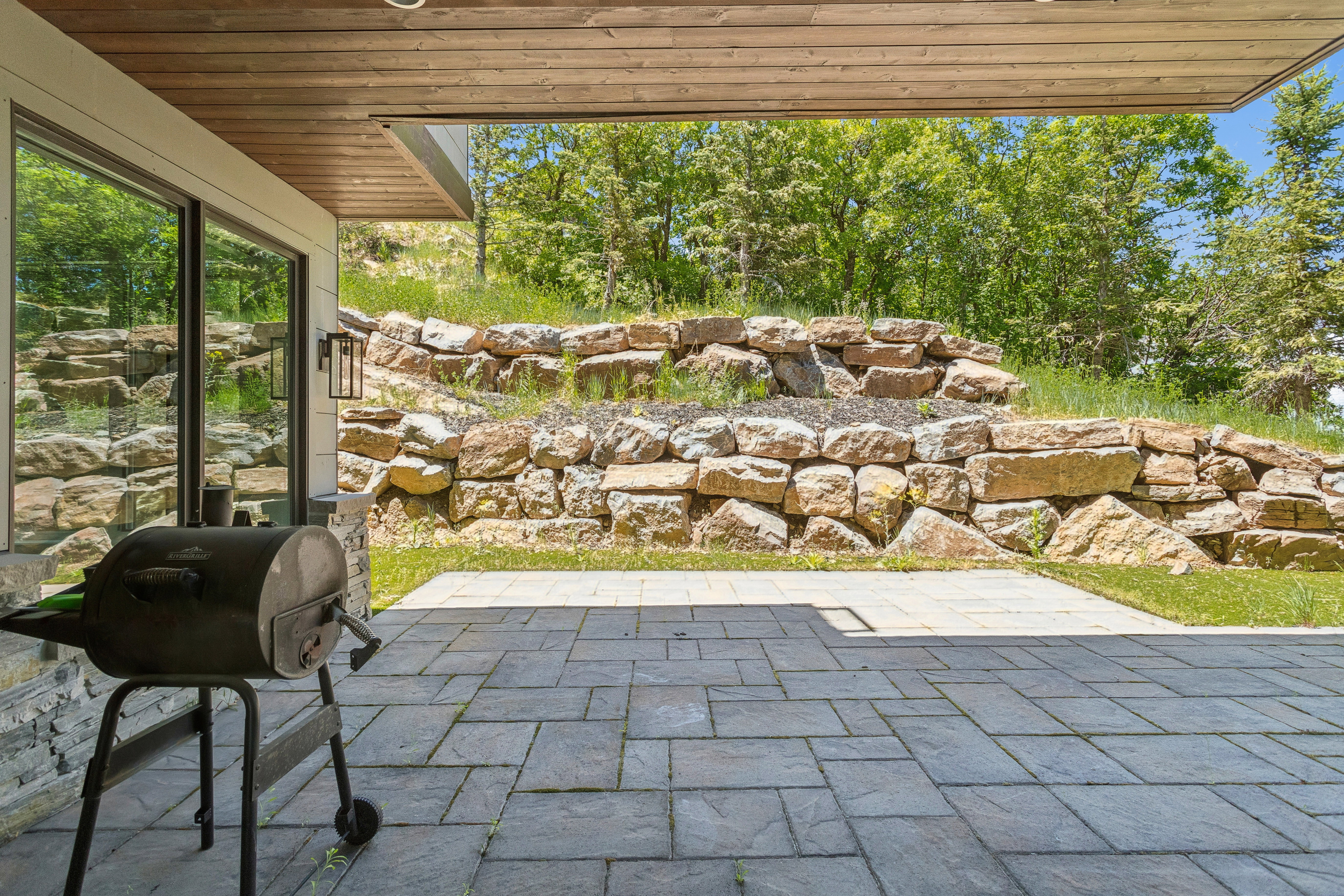 Covered patio featuring paver flooring and recessed lighting