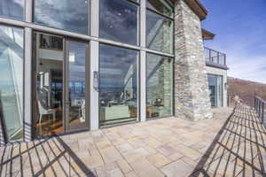 Expansive paver patio offering direct access to the interior via double glass doors