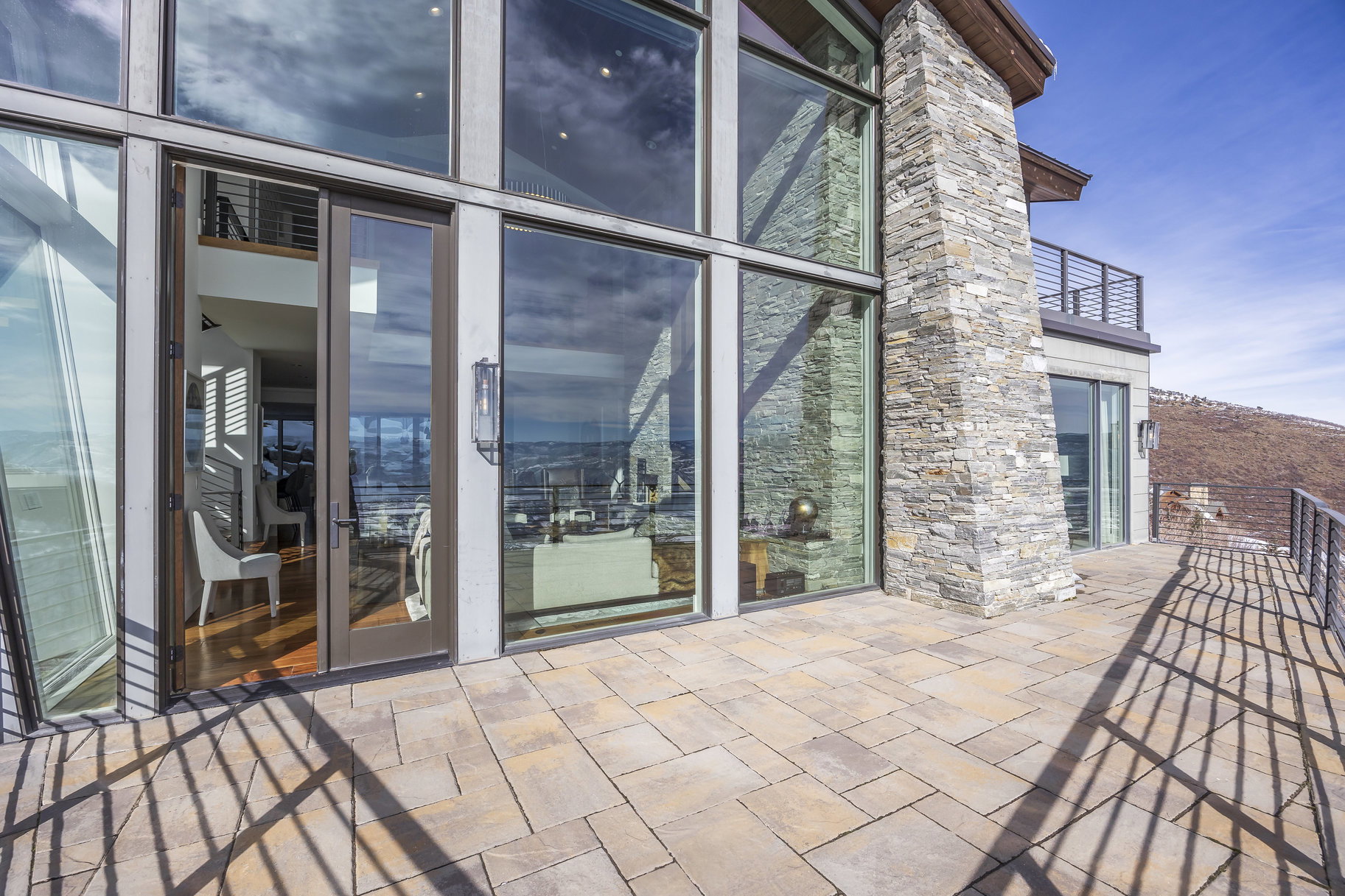 Expansive outdoor patio with paver flooring