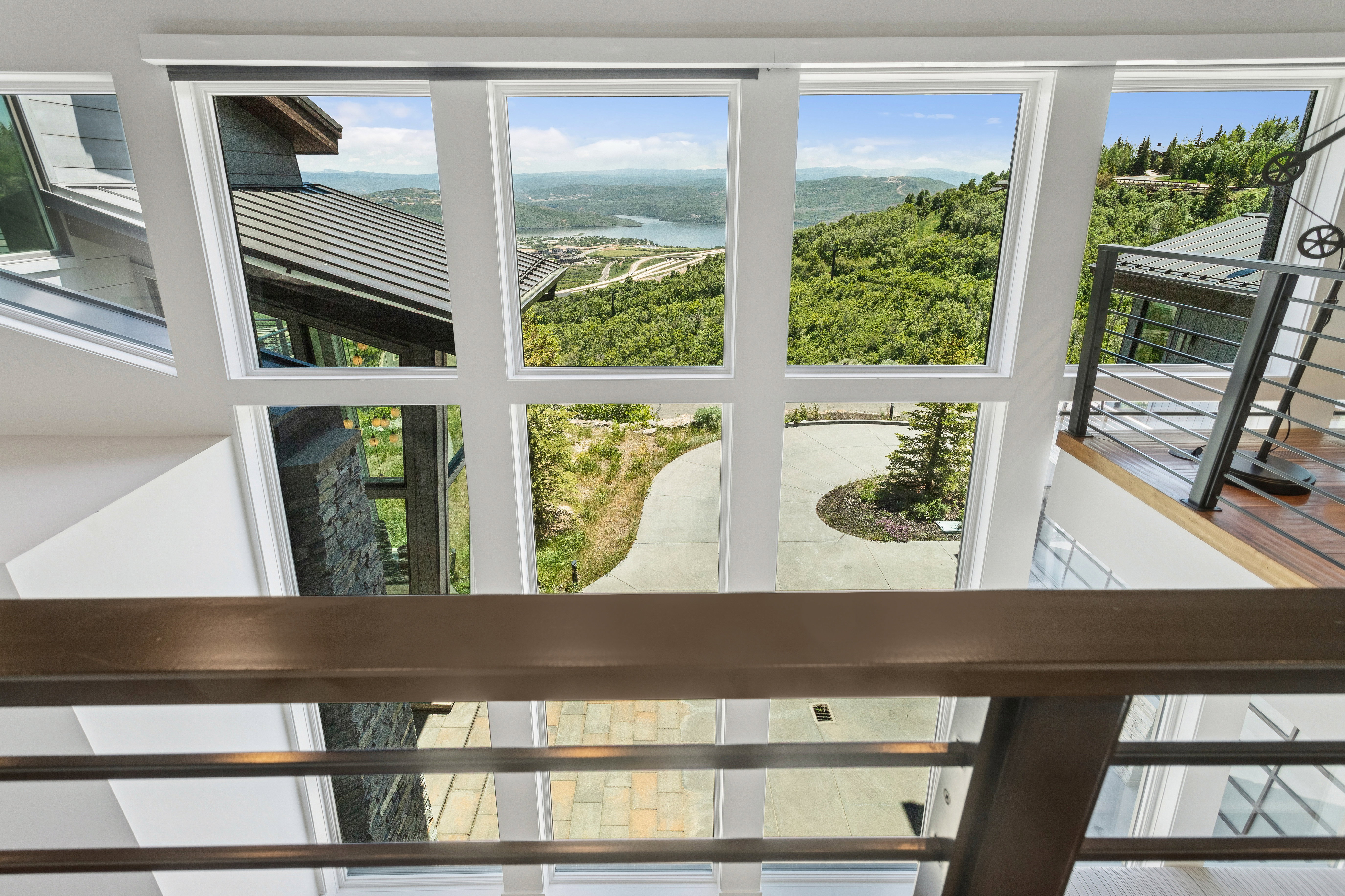 Expansive window wall offering broad landscape and water scenery