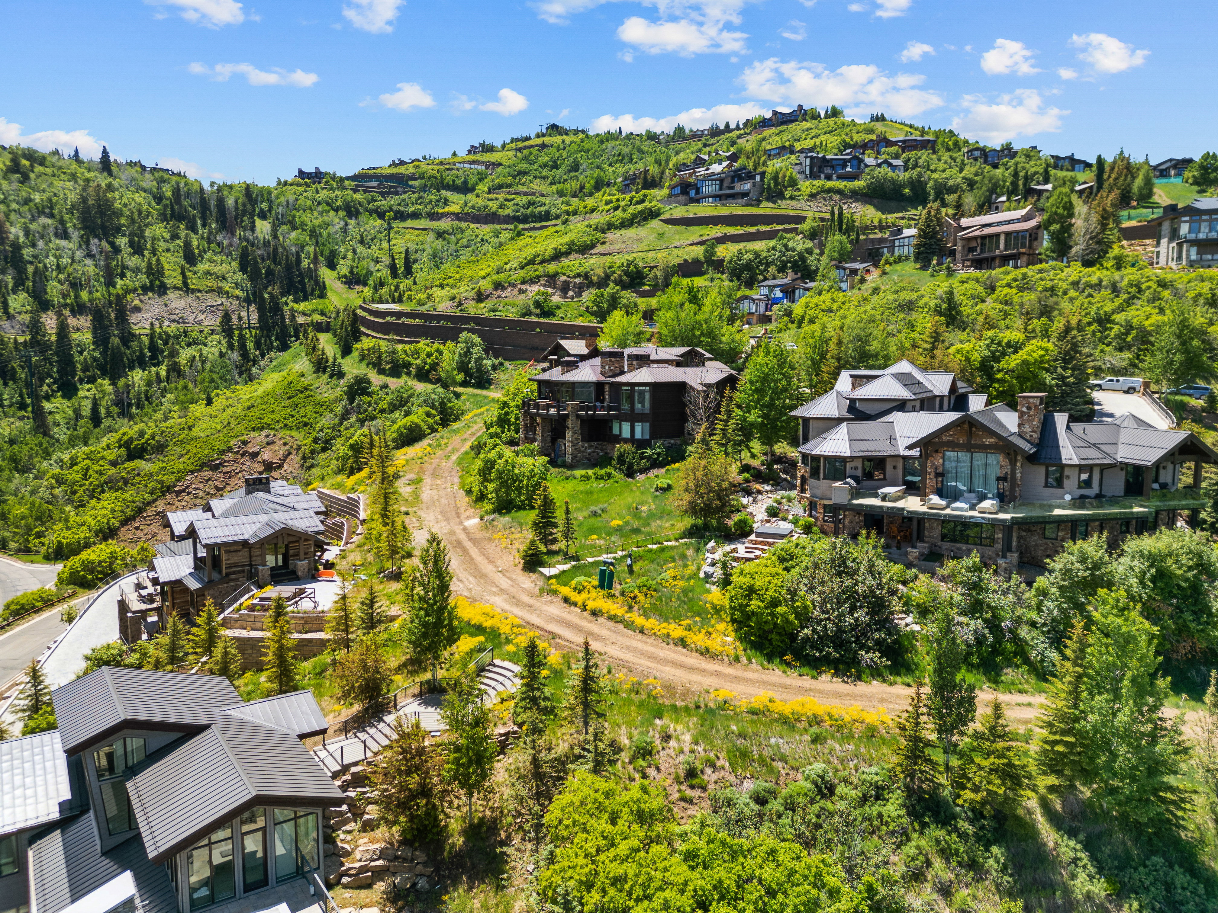 Hillside property featuring expansive landscaping and multiple levels