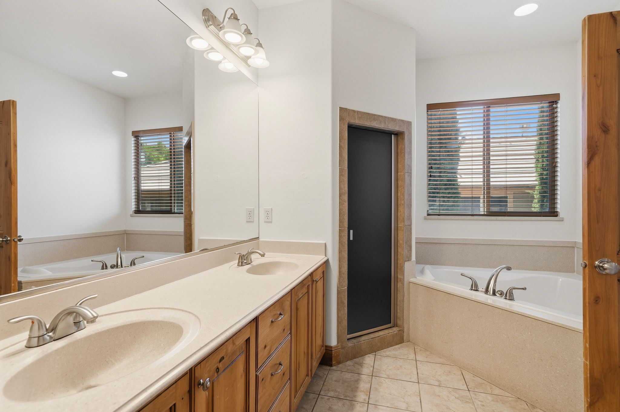 Dual vanity with integrated sinks and wood cabinetry