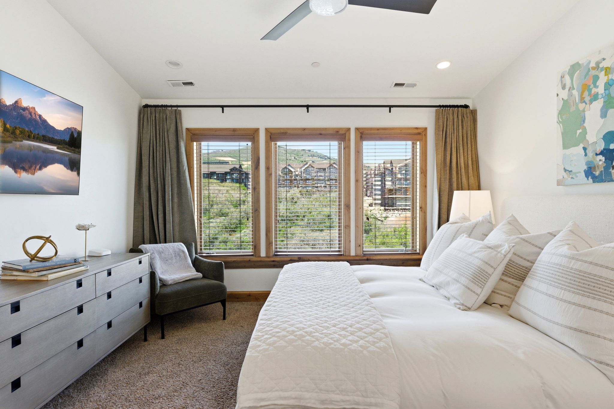 Bedroom featuring a ceiling fan, three windows with wood trim and blinds, recessed lighting, and carpeting