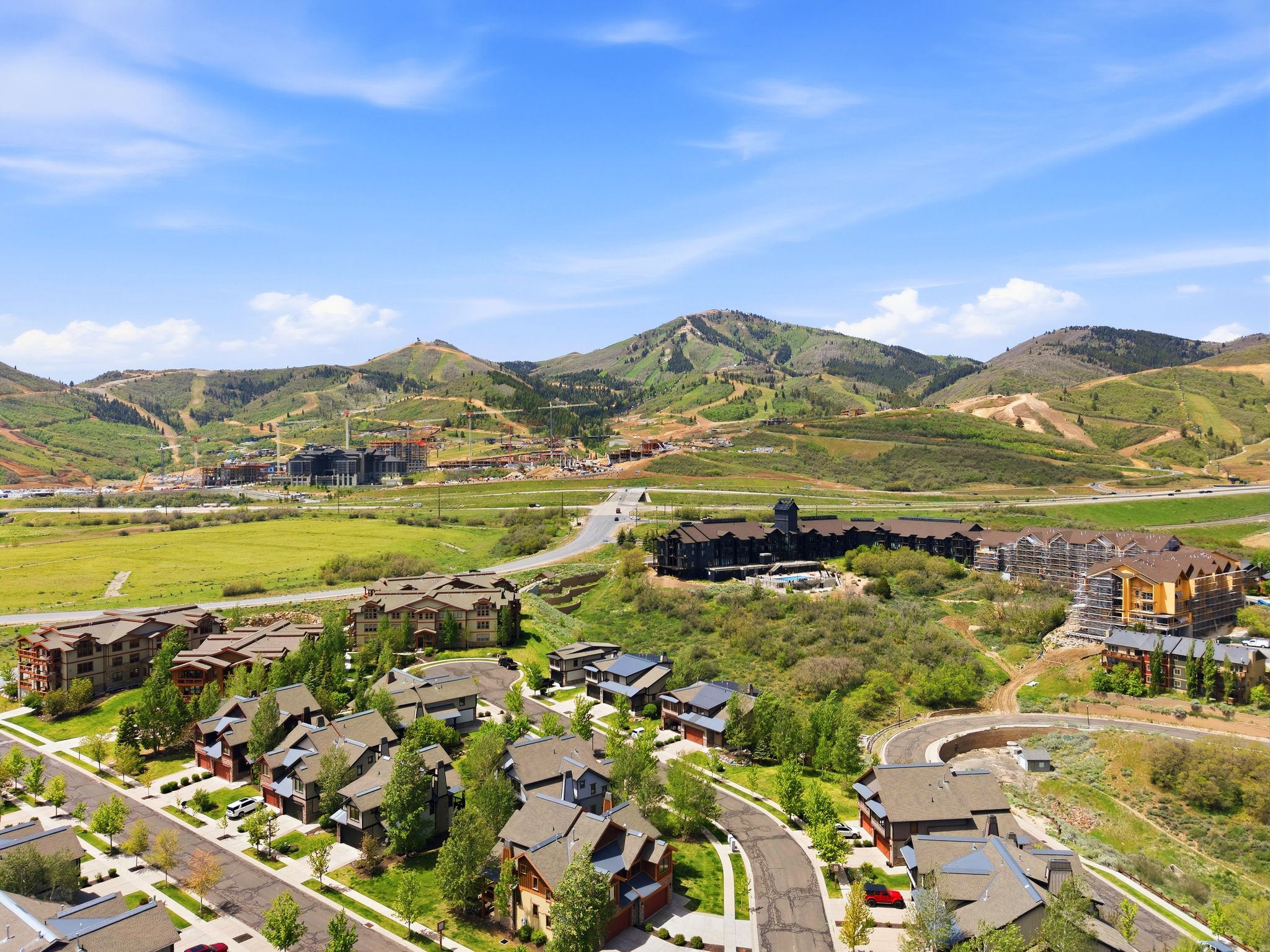 Mountain landscape featuring residential properties and resort-style buildings