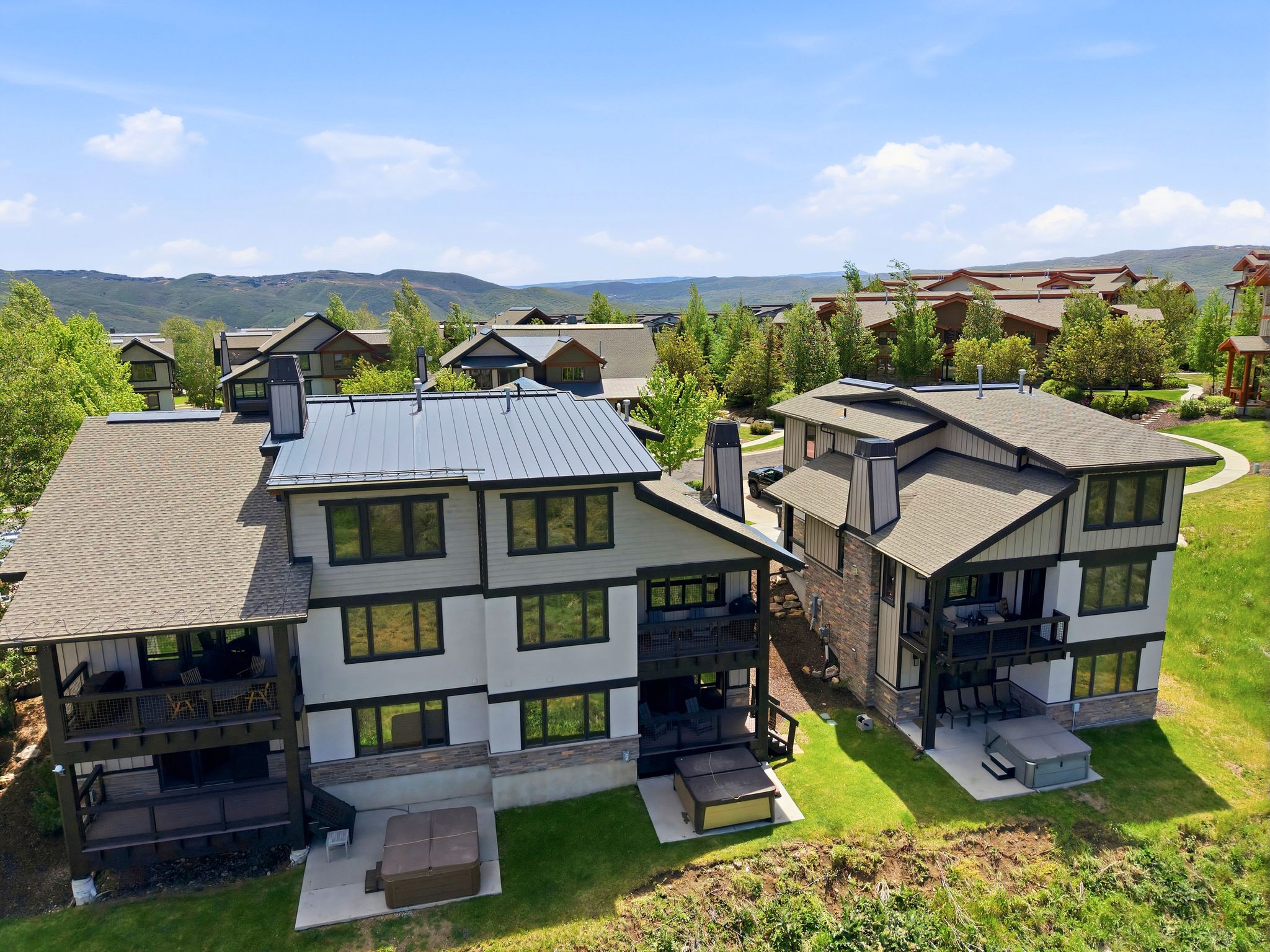 Modern alpine architecture featuring stone and panel siding