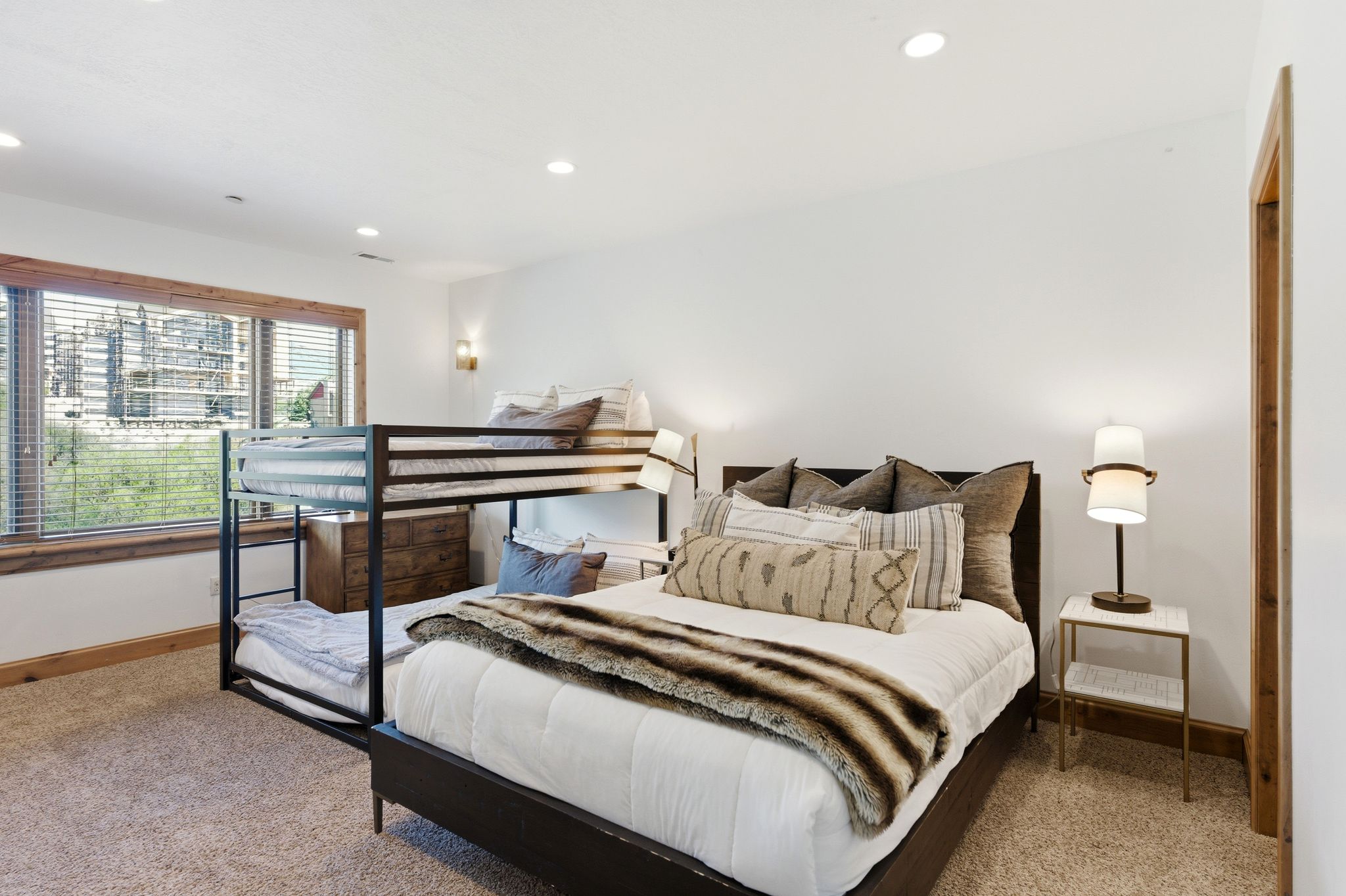 Bedroom featuring neutral-toned carpeting and white walls