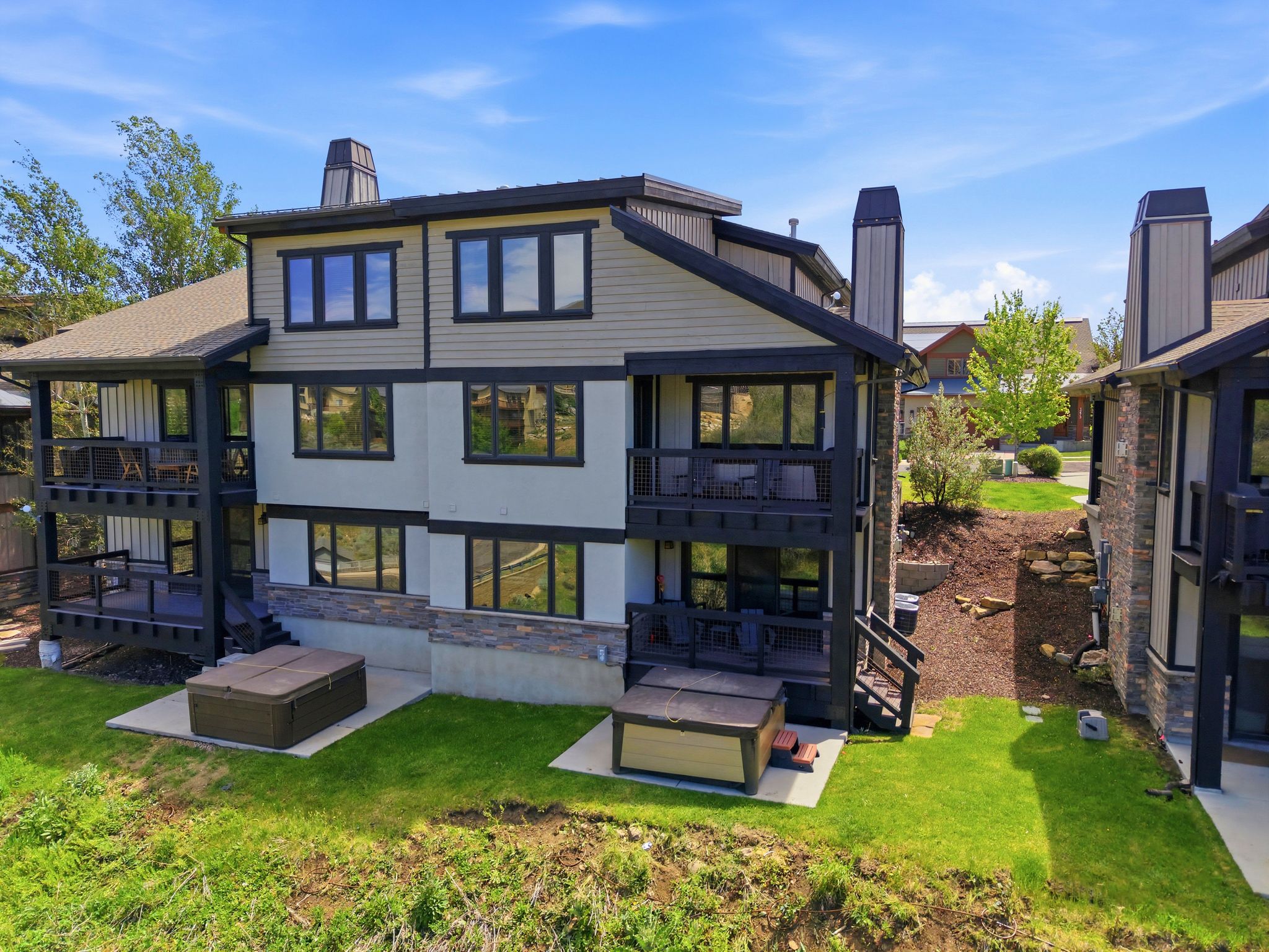Multi-level exterior with balconies and a patio