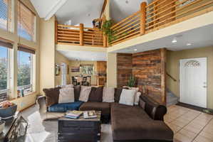 Vaulted ceilings with a wood-finish balcony overlook