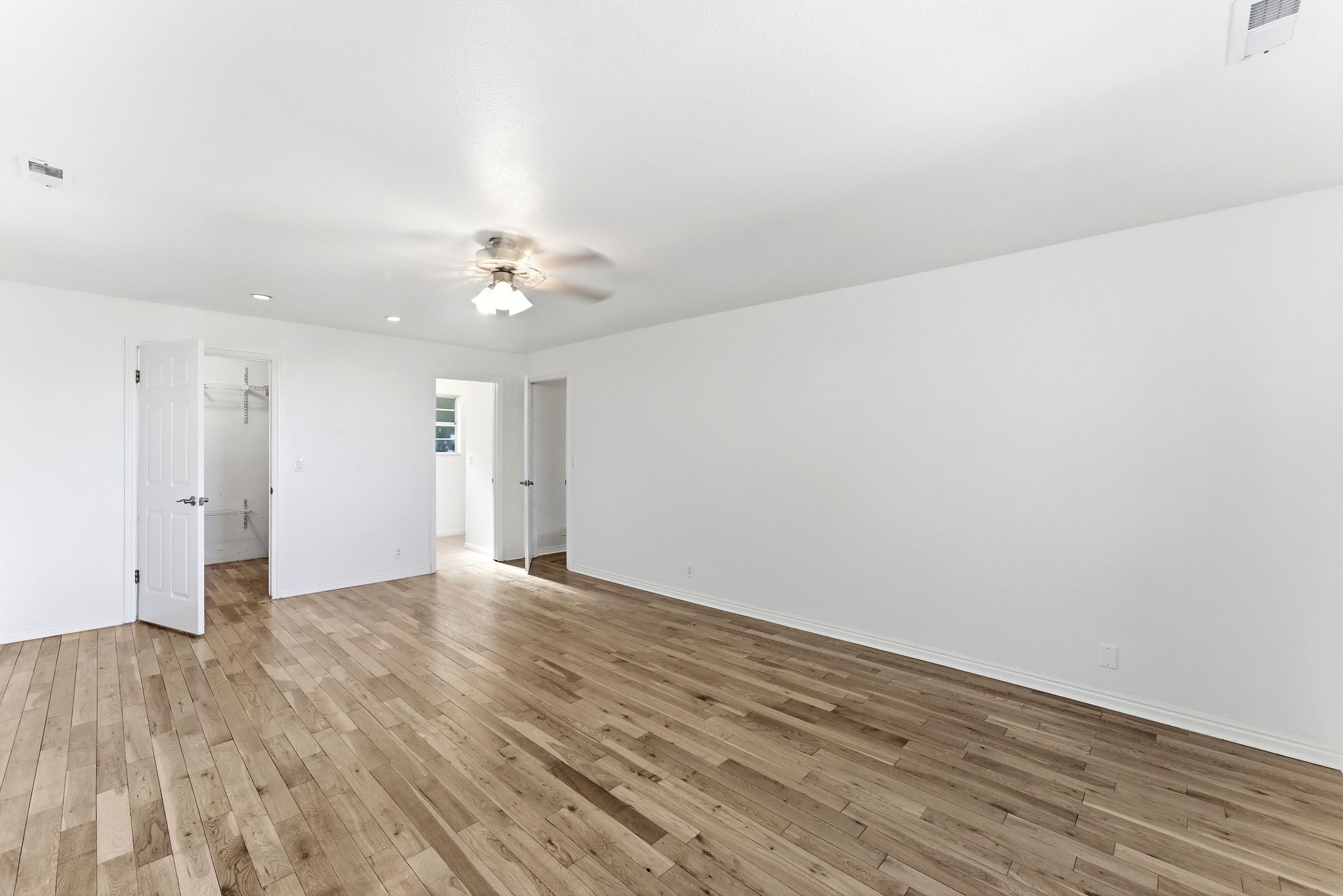 Spacious primary suite with walk-in closet.