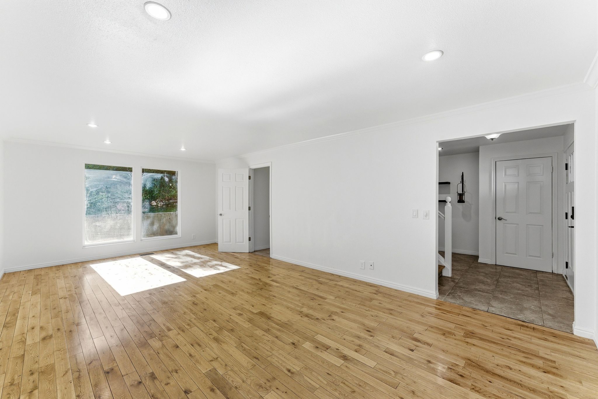 Spacious living room with hardwood floors