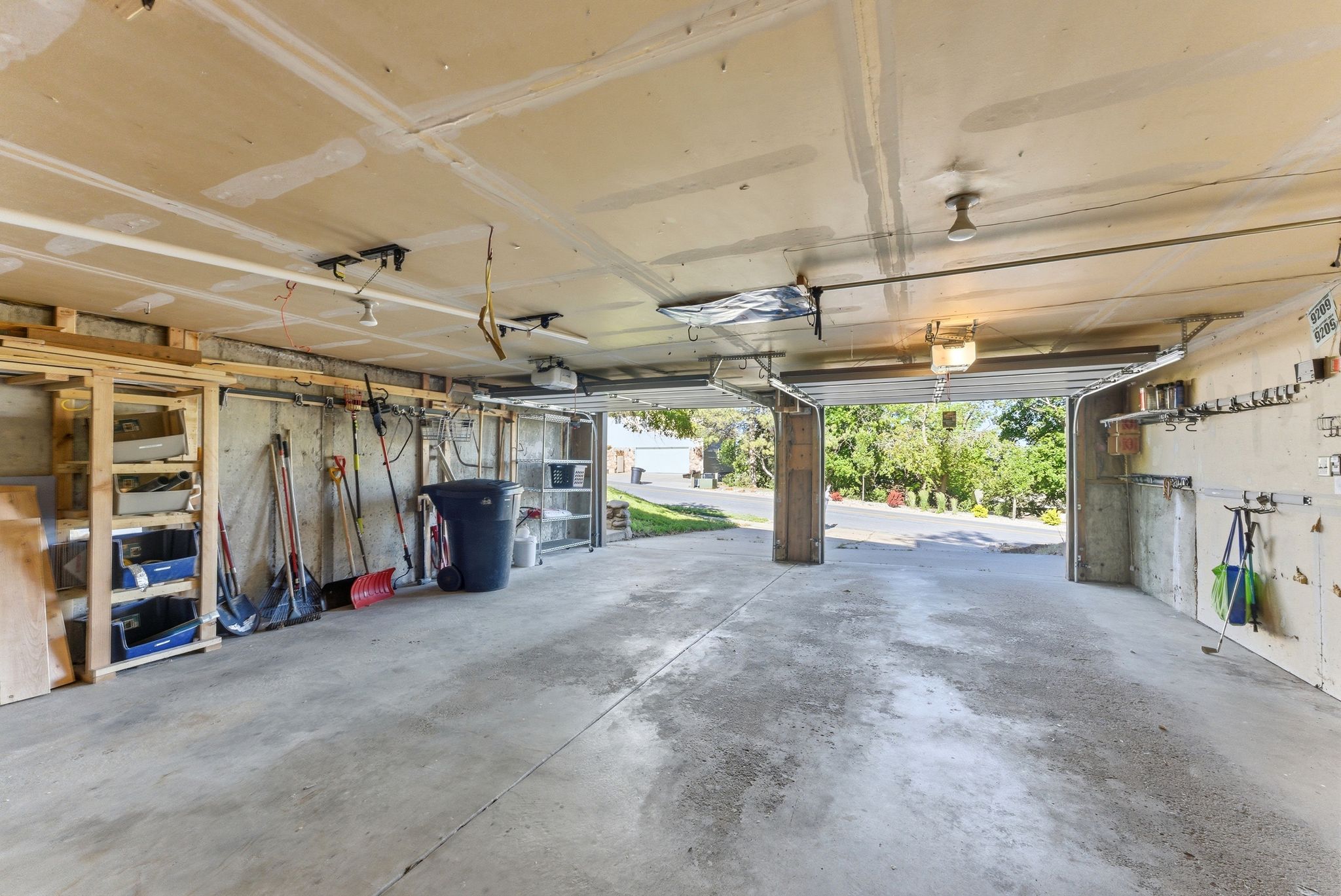 Concrete flooring in a spacious garage with exposed concrete walls