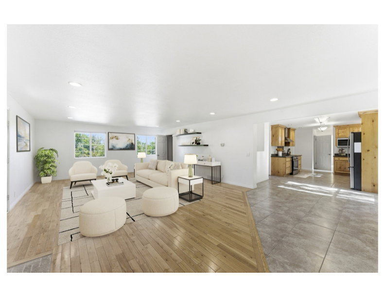 Virtual staged - Spacious open-concept living area featuring light wood-finish flooring and so much natural light