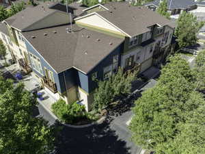 Multi-level residential structures featuring varied exterior siding, gabled roofs, and multiple balconies