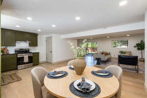 Open-concept living space featuring wood-finish flooring