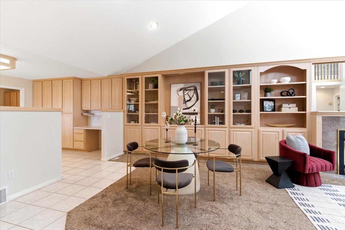 Built-in cabinetry and shelving with glass-front uppers and open display areas