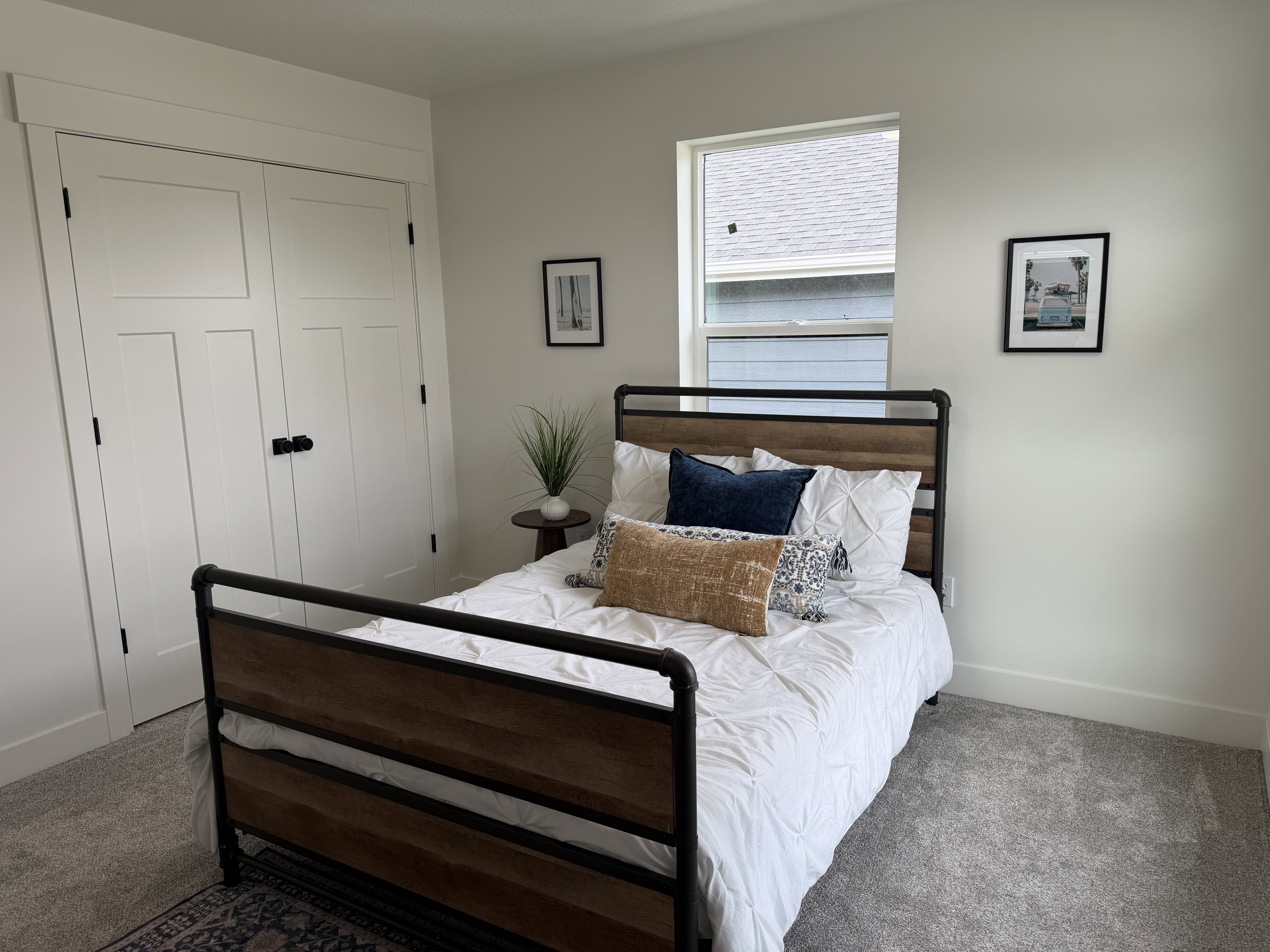 Interior room featuring light gray wall paint and matching carpet flooring