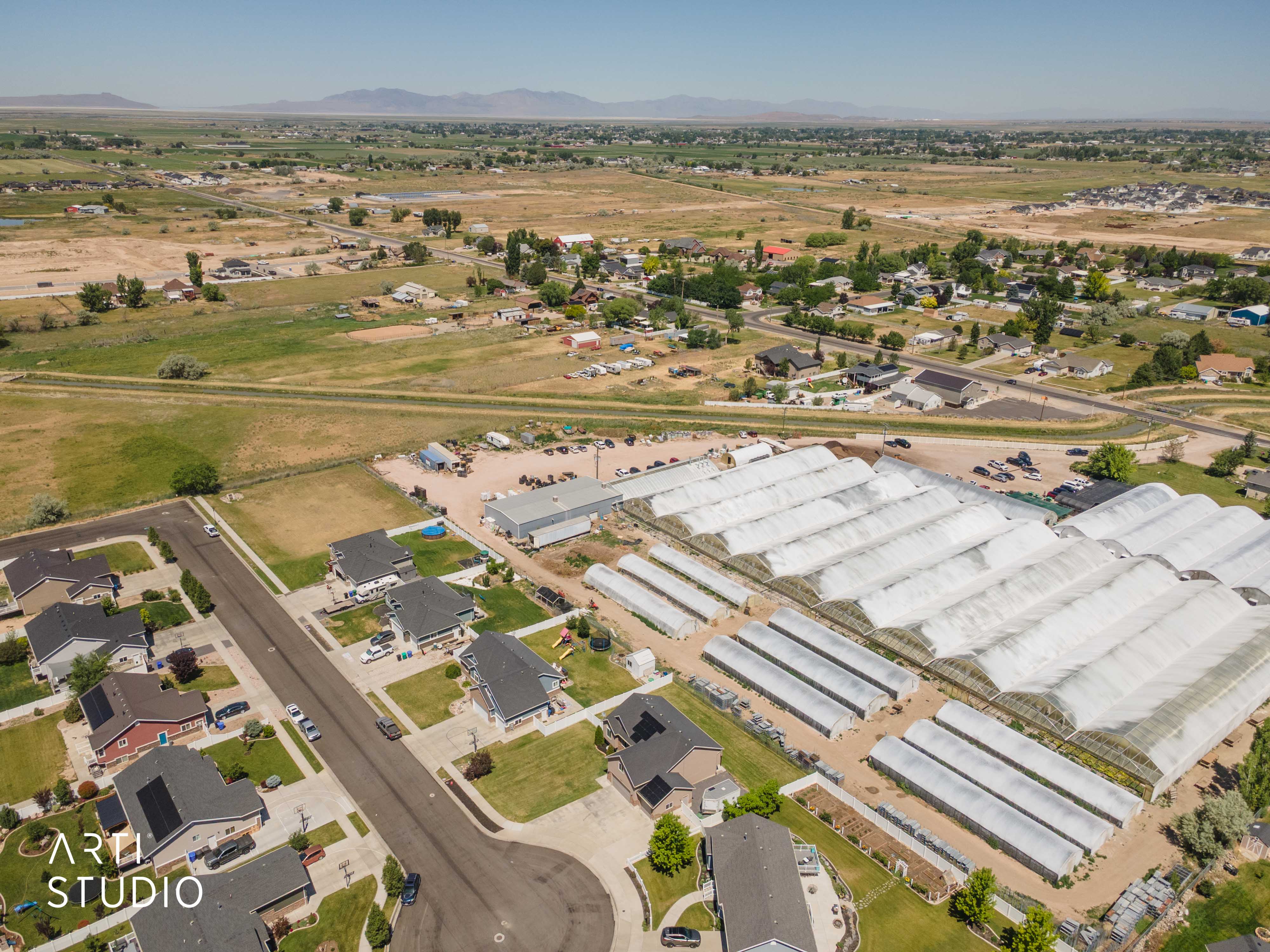 Expansive property featuring multiple large-scale greenhouses
