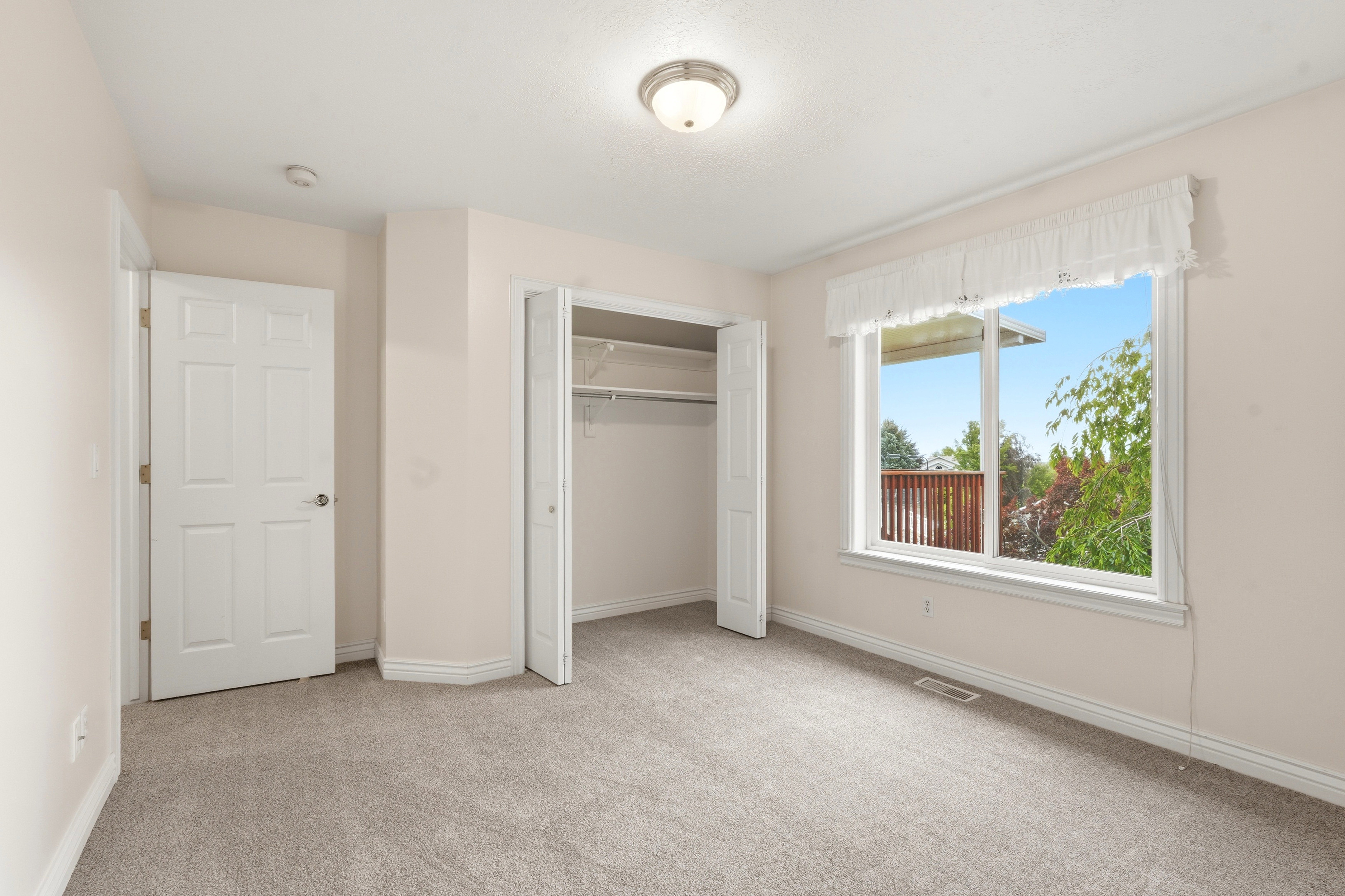Room featuring neutral carpeting and light-toned walls
