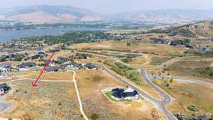 Expansive land parcel featuring natural, arid vegetation and a flat building site